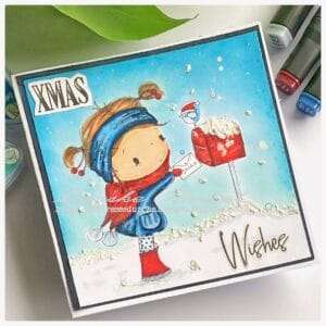 Santa Post card All Dressed up stamps A handmade christmas card with a a girl posting mail in a red mail box with a snowy background
