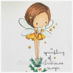 Close up picture of the digital stamp from All Dressed Up Stamps Coloured digital stamp Fairy Trea. A fairy standing on a christmas tree in a yellow golden tdress.
