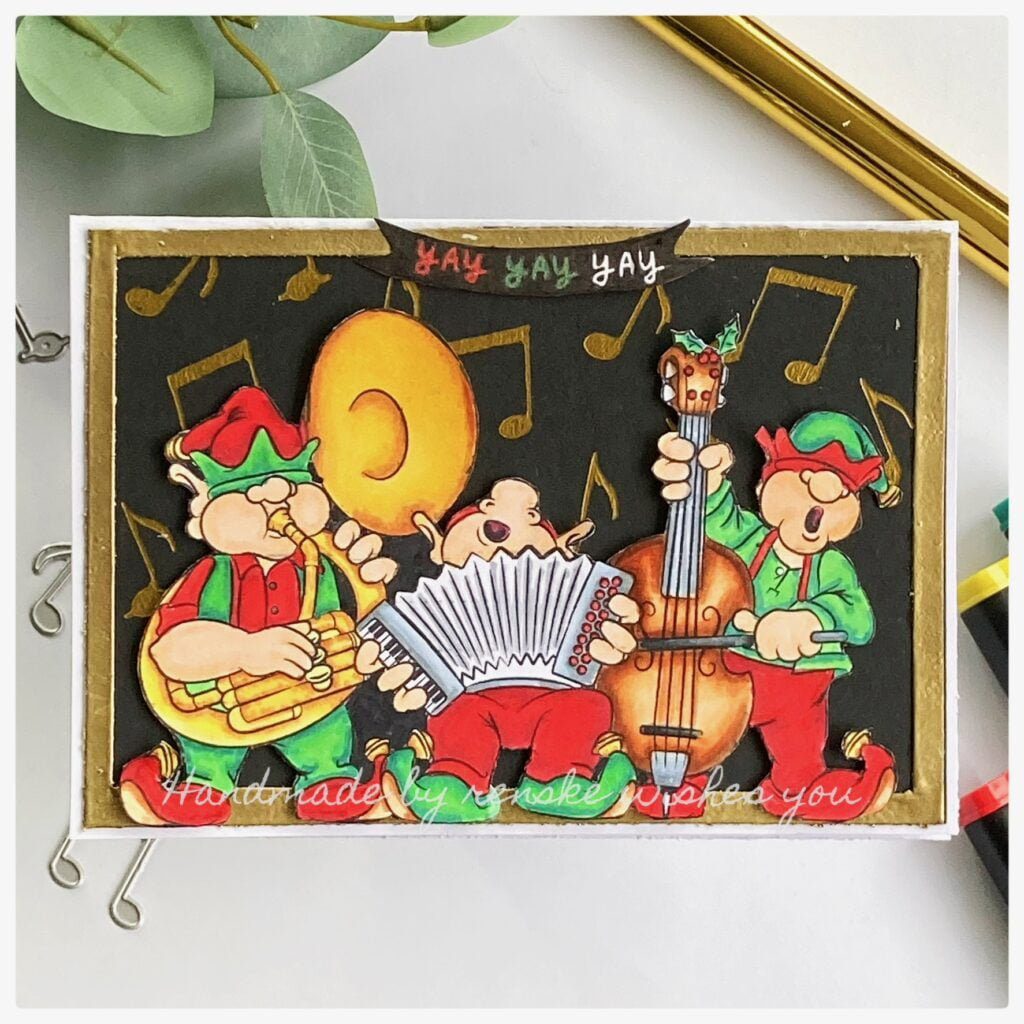 My finished Christmas Choir card. 3 men in their green and red clothes plaining the golden tuba, bas and acccordion.