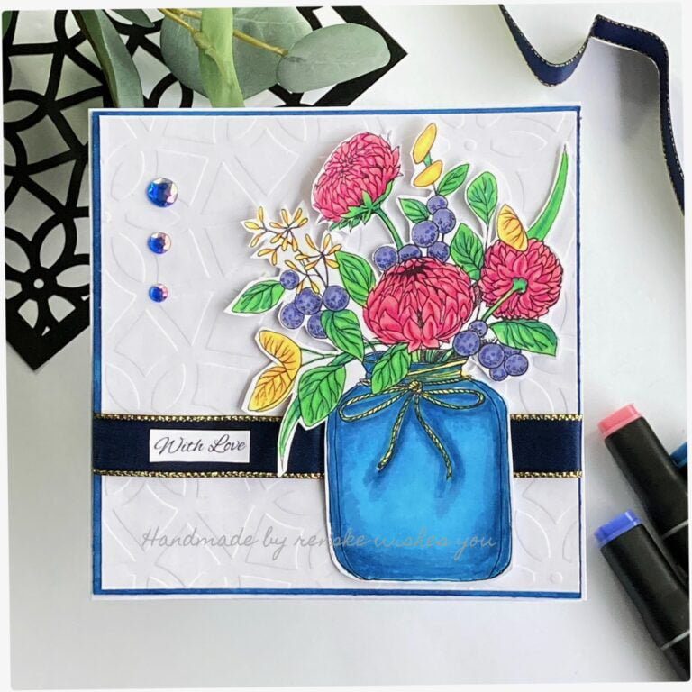 My finished Handmade Flower card with beautiful pink flowers and purple berries standing in a blue vase.