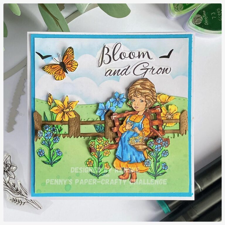An exquisite handmade Flower Garden card featuring a digital stamp of a girl holding a basket of flowers in a blooming garden. The charming scene showcases vibrant summer colors, with a serene blue sky and lush green grass in the background.