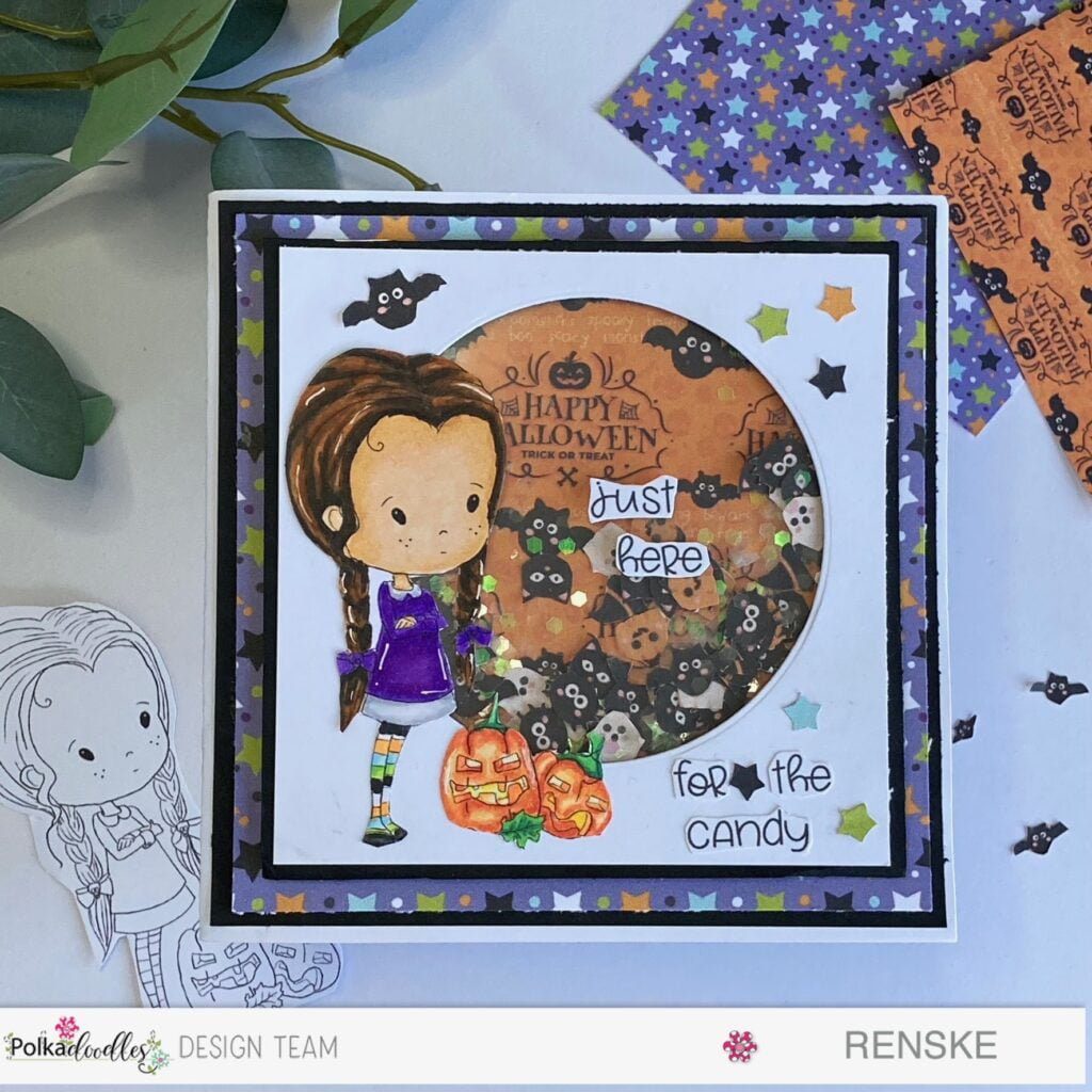 An enchanting Halloween Shaker Card adorned with a captivating Winnie Wednesday Pumpkin digital stamp, surrounded by eerie shaker elements and bewitching Halloween-themed decorations