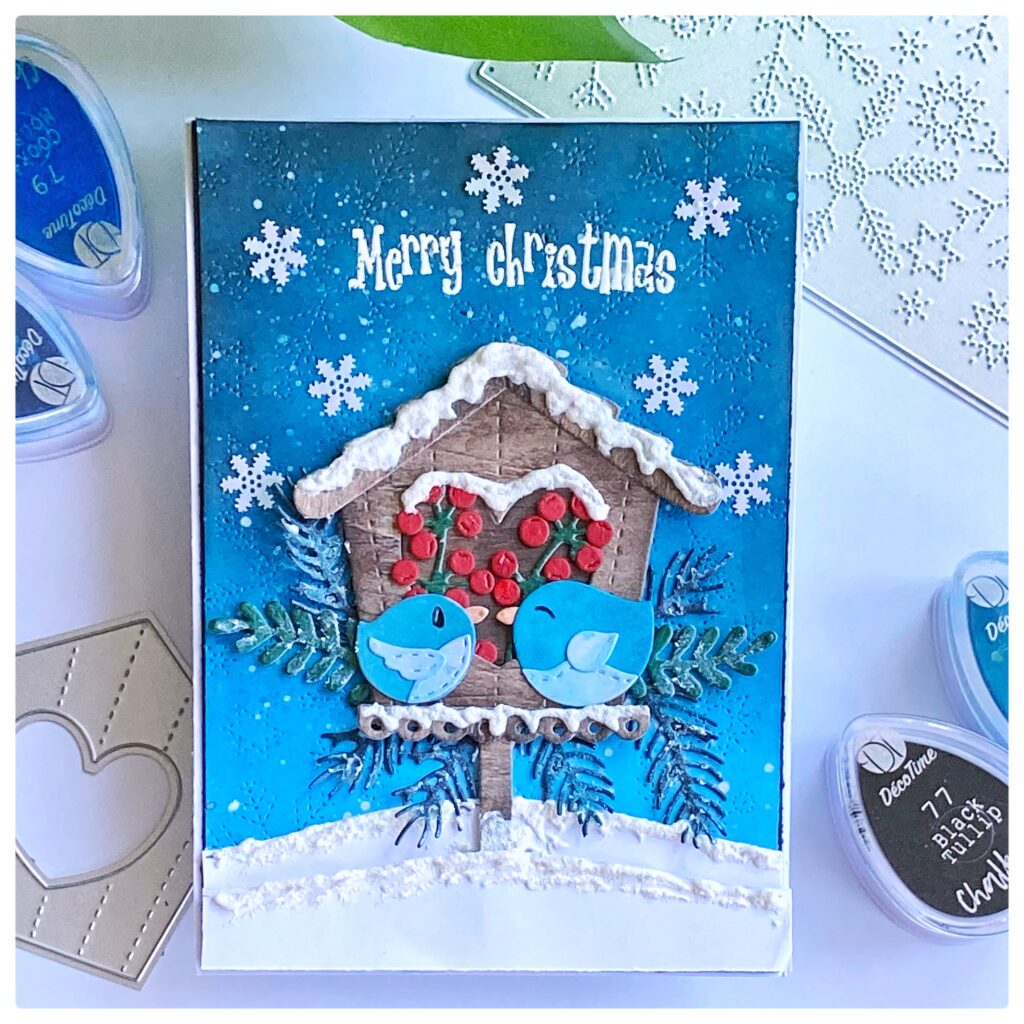 A christmas bird house christmas card.