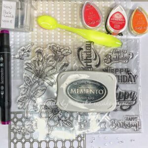 Materials for Floral Birthday Card - Image showing supplies used including stamps, inks, paper, and embellishments.