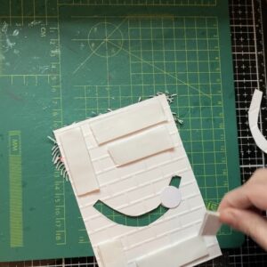 Picture about how to add the foam tape to the background of the stone wall panel.
