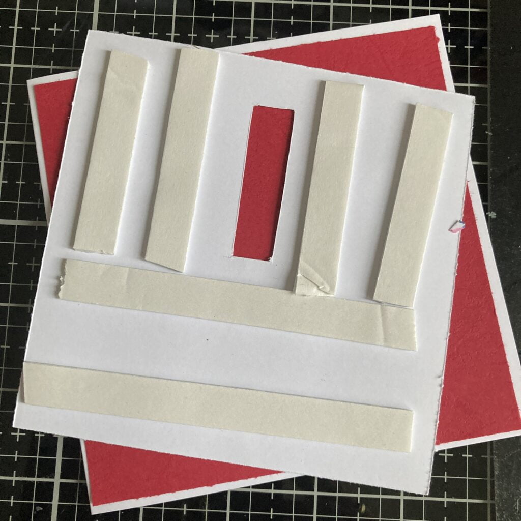 Applying foam tape to the back of the patterned paper on the Handmade Birthday Slider Card. This step adds dimension to the card, creating space for the interactive slider mechanism. The foam tape ensures the smooth movement of the slider, enhancing the overall visual impact of the handmade creation.
