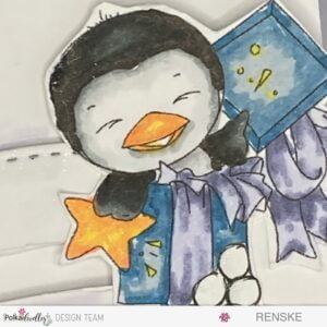 Close-up of hand-coloured digital stamp Waddy popping out of a present, part of a winter-themed slimline slider card showcasing Polkadoodles' playful penguins.