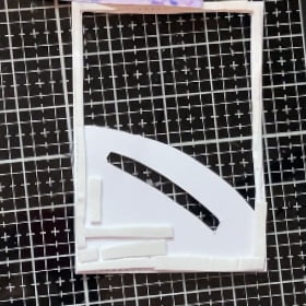 Picture of the back of our frame panel. It is showing how to add the foam tape.