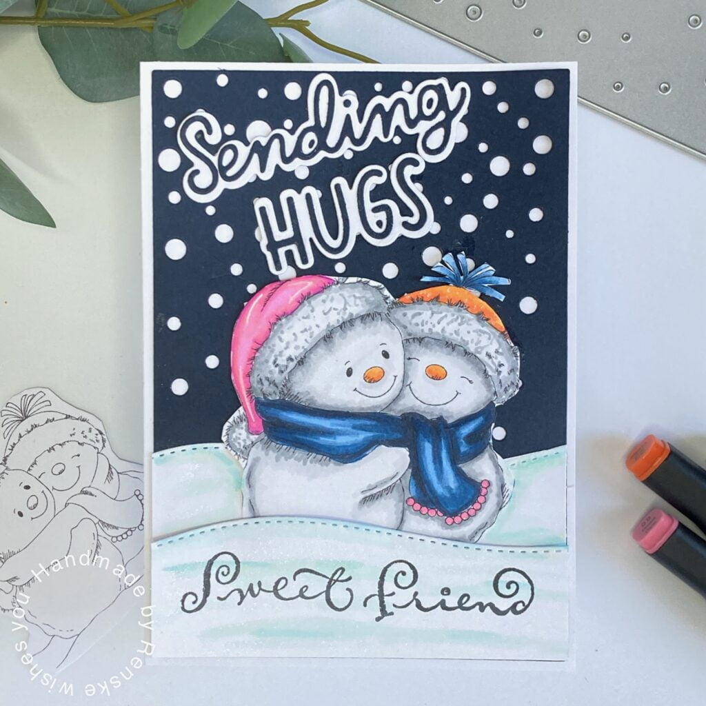 Handmade winter-themed card featuring adorable snowmen sharing a hug, set against a snowy background with layered snow hills and heartfelt sentiments.