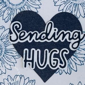 Close-up of Sentiment 'Sending Hugs' on Monochrome Blue Floral Card