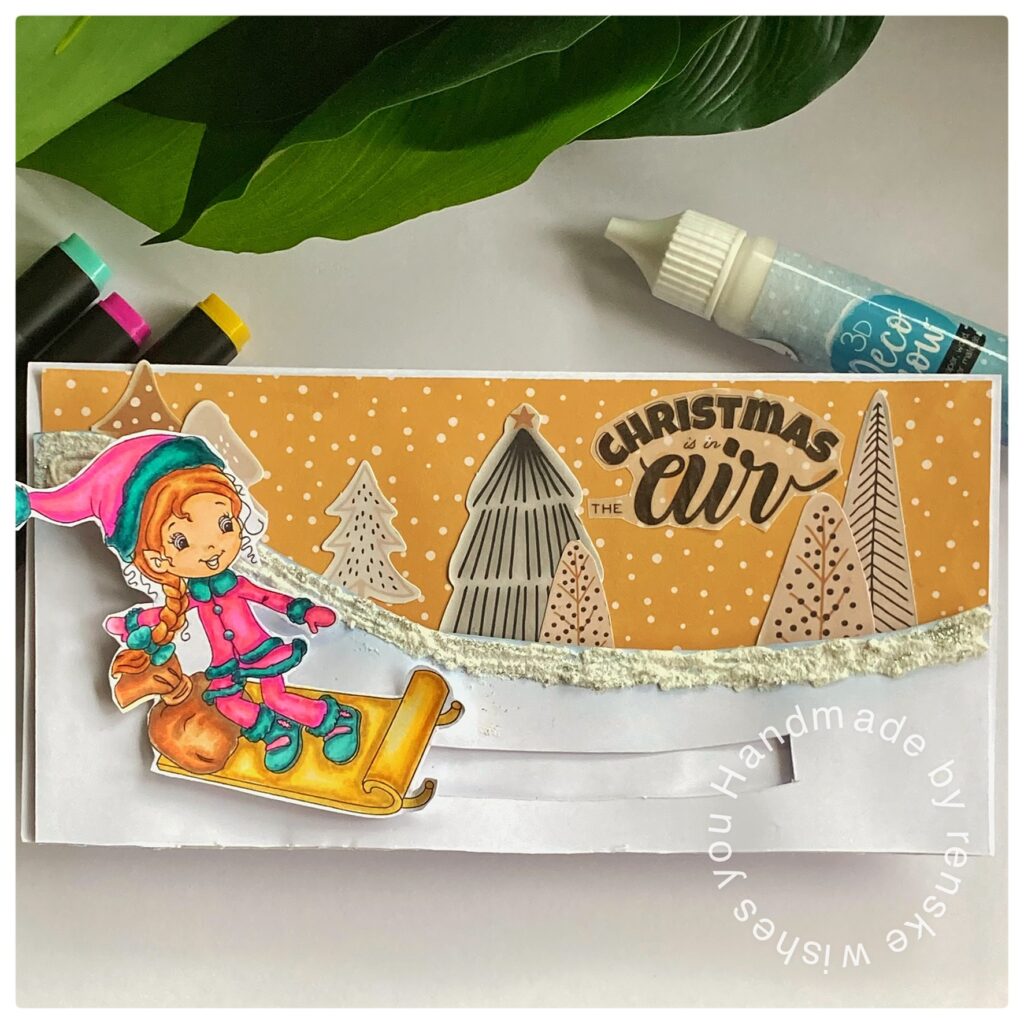 A christmas slimline card with untraditional colours. I used yellow, pink and teal. A girl sliding through the snow on her snowboard.