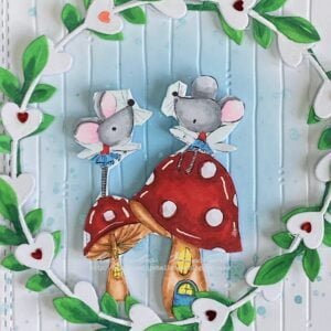 Close-up view of the hand-colored digital stamp 'Two Little Fairy Mice.' Delicate shades of gray, pink, blue, and red bring these whimsical mice to life, showcasing intricate details and expert coloring with alcohol markers.