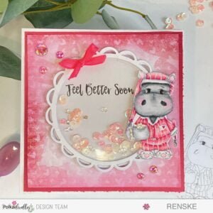 Front view of a handmade Hippo Shaker Card featuring a charming design with a colored hippo, shaker element, and delightful embellishments. Crafted with Polkadoodles digital stamps, this card radiates warmth for a feel-better occasion