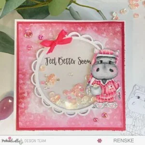 Front view of a handmade Hippo Shaker Card featuring a charming design with a colored hippo, shaker element, and delightful embellishments. Crafted with Polkadoodles digital stamps, this card radiates warmth for a feel-better occasion