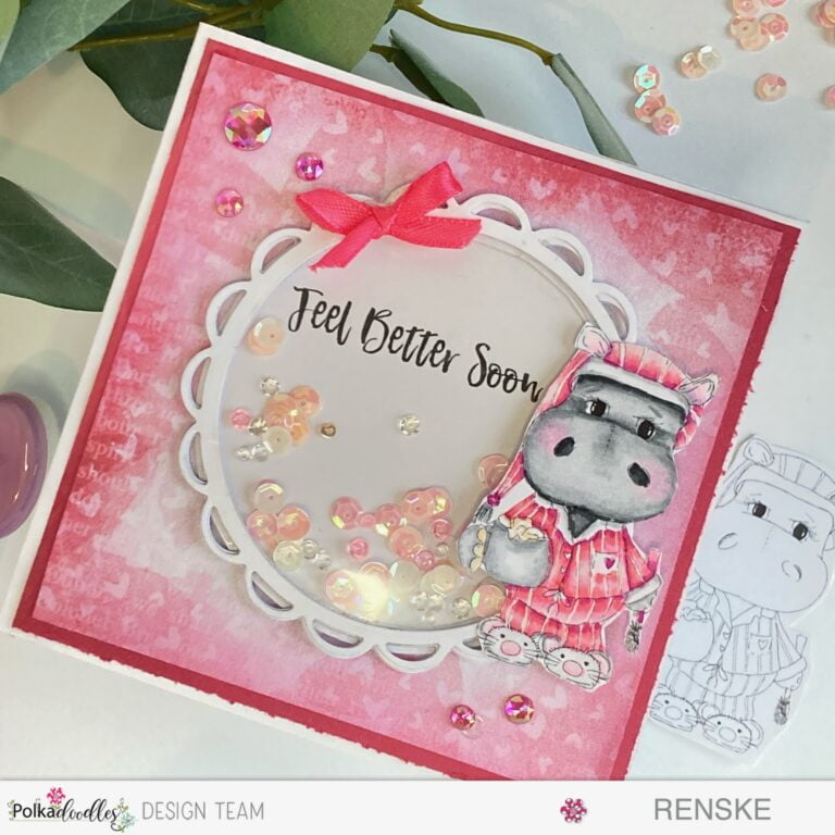 An image of a whimsical and vibrant Hippo Shaker Card, crafted with love for a feel-better occasion. Handmade with Polkadoodles digital stamps, the card showcases a delightful scene featuring a colored hippo, a shaker element, and decorative embellishments.