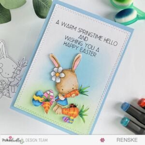 Handmade simple easter card Burnny Rabbit with spring carrots Polkadoodles Overhead angled view of a beautifully crafted simple Easter card, showcasing intricate details and vibrant colors. The charming bunny rabbit with spring carrots digital stamp takes center stage, surrounded by delicate spring foliage and heartfelt Easter sentiments.