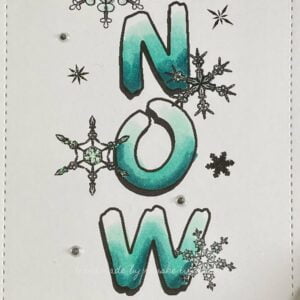 Close up picture lettres NOW from the vertical stamp Let it snow from D.R.S. Designs. Close-up photograph capturing the beautifully colored gradient letters 'now' on the winter card. The letters feature a gradient color effect, transitioning smoothly between shades of Teal Blue, Cool Mint, and Cool Shadow, adding vibrancy and depth to the card's design.
