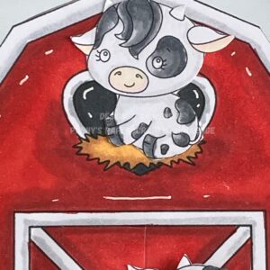 close up picture of the cow sitting in th hay lose-up of cow illustration nestled in hay inside the barn on the greeting card. The cow, with black and white patches, sits contentedly amid golden hay. The hay is depicted in shades of yellow and brown.