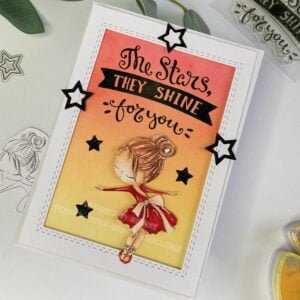 Ballerina Card Take a Bow All Dressed Up Stamps (2) A unique perspective of the handmade ballerina card, captured from above at a slight angle. A ballerina card featuring an elegant ballerina design in a vibrant red dress with intricate details