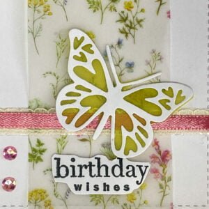 Close up picture Butterfly with vellum A close-up image of the large butterfly with yellow vellum, highlighting the intricate design and beauty of vellum in card-making.