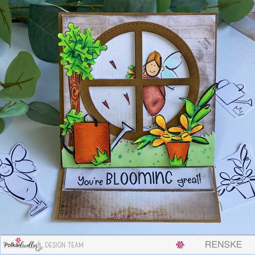 Front view of an intricately designed easel card tutorial featuring a charming scene with a girl, flowers, a tree, and a window, crafted using Polkadoodles products
