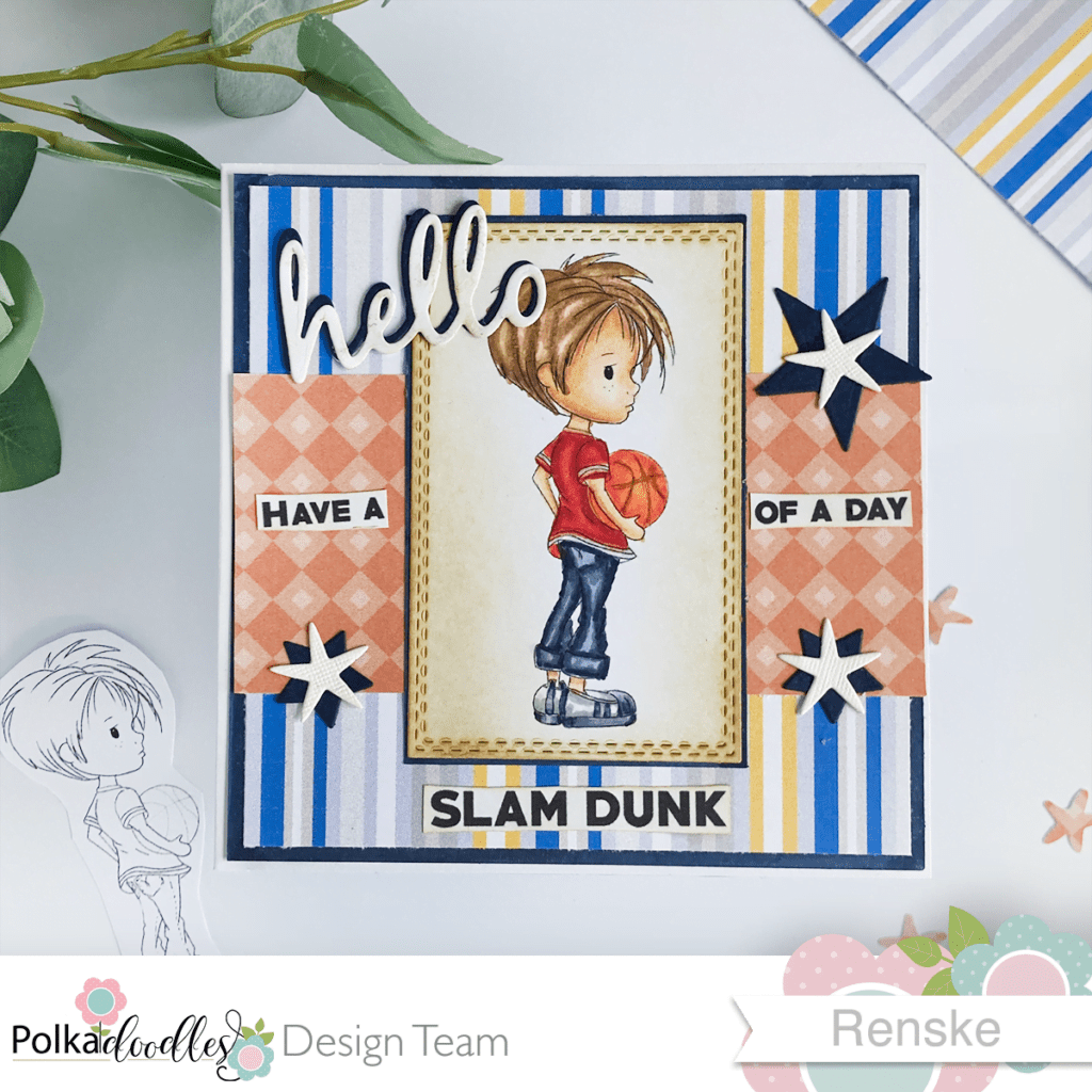 Overhead view of DIY basketball card featuring 'Basketball - Little Dudes' digital stamp. The card is laid flat, showcasing the entire design. The focal image, a young basketball player, is prominently displayed in the center, surrounded by layered patterned papers and a coordinating border.