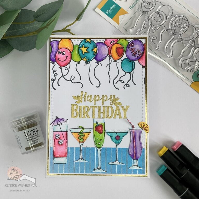 Handmade birthday card with colored cocktails and balloons, viewed from above with the card straight into the picture.