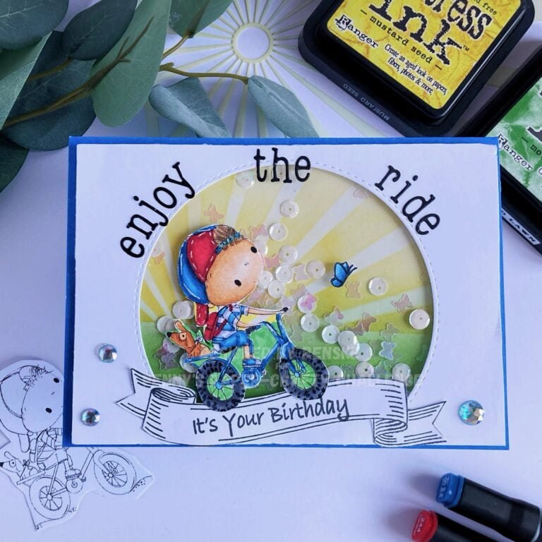 Vibrant handmade shaker card featuring Spring Bike Ride digital stamp. The card is viewed from the top, showing the entire design with focus on the shaker window filled with butterfly sequins and white round shaker elements.