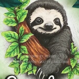 A close-up photo of the colored digital stamp on the handmade sloth card. The sloth image is beautifully colored with vibrant hues, capturing the adorable expression of the sloth as it clings to the branches.
