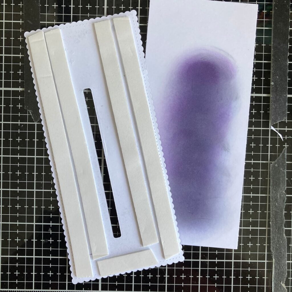 Foam tape and the panel of the back (1) Image of the hot air balloon slider card's background panel with foam tape and the panel that will close the back. The photo shows the assembly process of the card