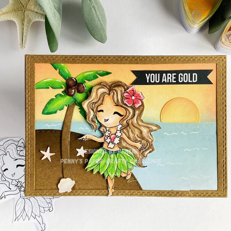 Top-down view of a completed beach card. The card lies flat and straight, showcasing a vibrant beach scene with a dancing girl in a Hawaiian skirt, palm tree, and sun. The background features blended distress inks in shades of red, orange, and yellow for the sky, and various blues for the sea.