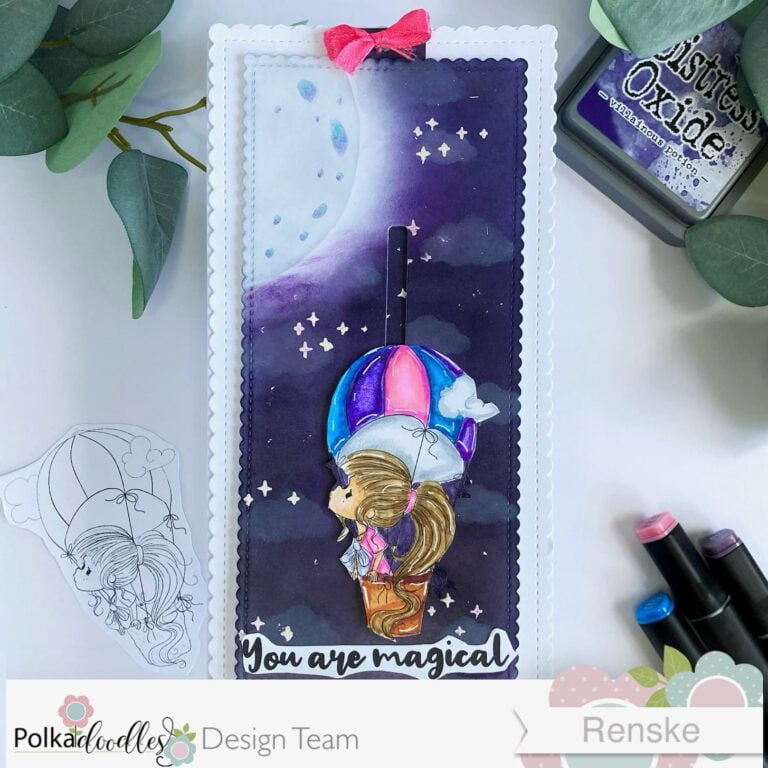 Top view of the completed hot air balloon slider card made with this slider card tuotorial. The card is laid flat with the slider fully down, showcasing the vibrant night sky background and whimsical hot air balloon.
