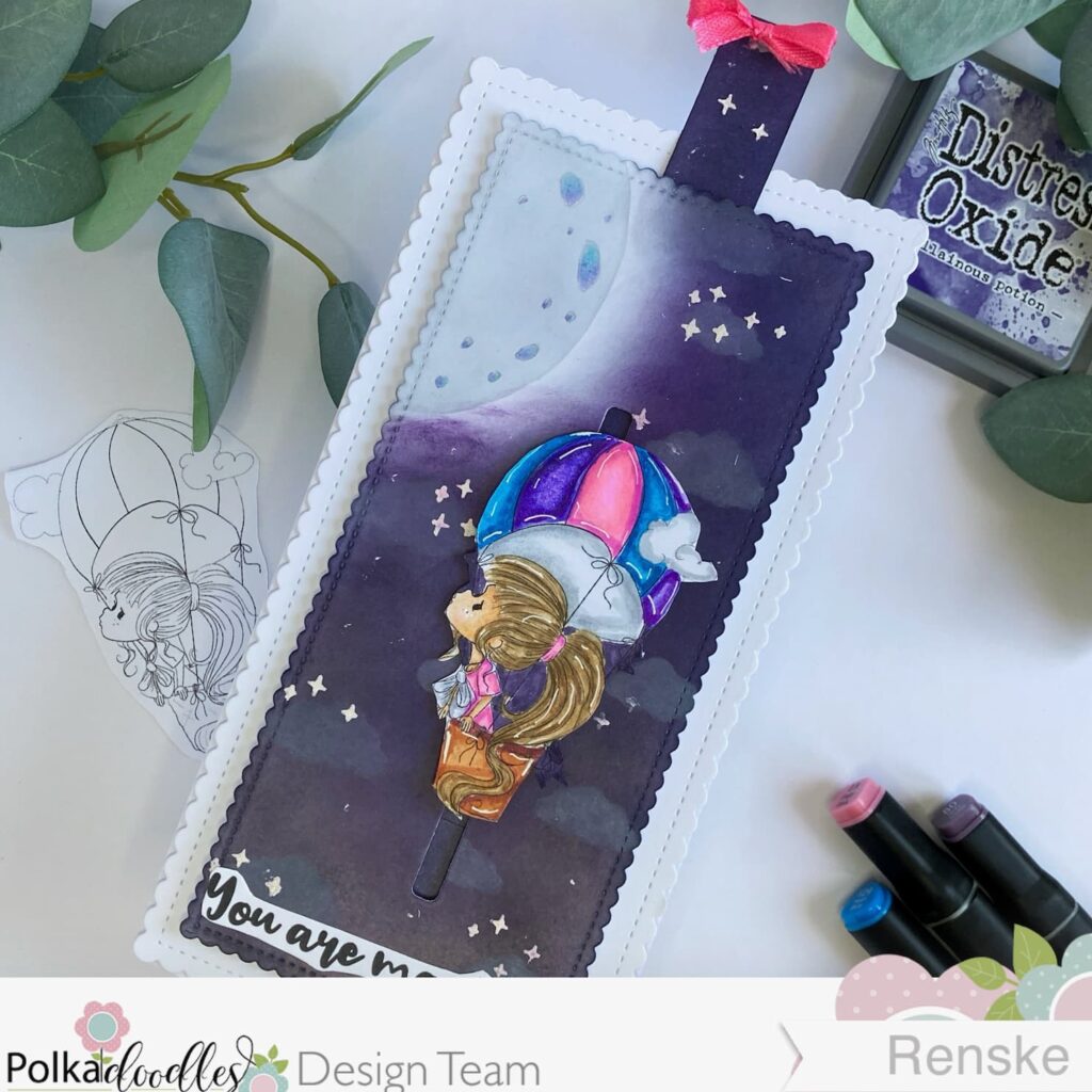 Hot Air Balloon Slider card The Sky is the Limit Polkadoodles 3 Angled top view of the hot air balloon slider card with the slider a bit up. The card is positioned slightly askew, revealing the hot air balloon elevated against the night sky background.