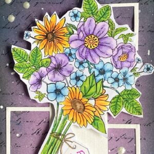 Close up picture coloured digital stamp Thanks a Bunch A close-up of the colored digital stamp 'Thanks a Bunch' from All Dressed Up Stamps on a handmade flower bouquet card, featuring detailed coloring of the flowers in green, yellow, purple, and blue hues.