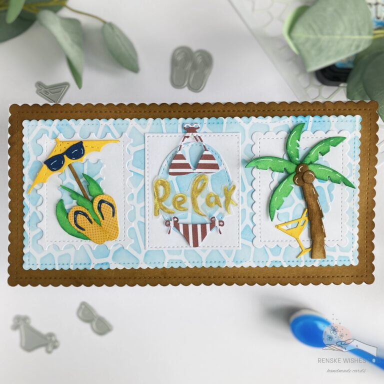 Top view of completed summer themed card with a swimming pool background showing palm tree, cocktail, parasol, sunglasses, bikini, and 'relax' text.