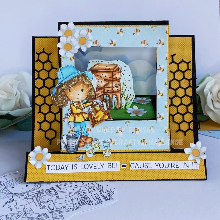 Front view of a beautifully crafted scene stepper card with a bee theme. The card features a layered 3D design with vibrant yellow and blue patterns, a bee-themed background, and a charming scene of a beekeeper surrounded by bees and honeycombs. This stepper card tutorial demonstrates the intricate details and dynamic layers of the card.