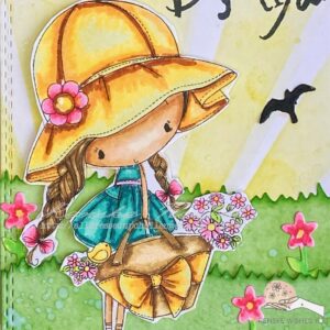Close up of the coloured digital stamp Little flower girl. Image of the colored Flower Girl digital stamp, showcasing the completed illustration. The Flower Girl is vibrant in her yellow hat, teal dress, and floral bag, with detailed coloring that enhances her whimsical design.