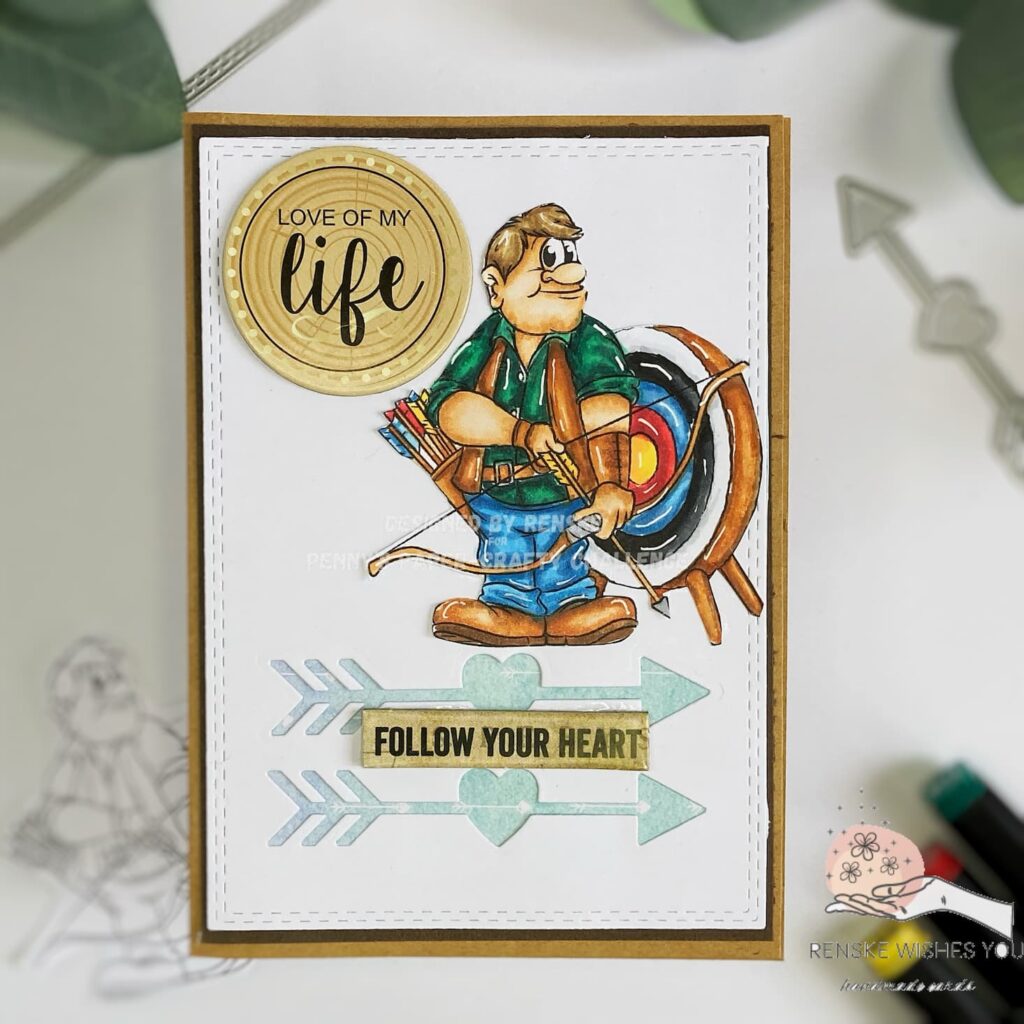 top-down view of the handmade masculine card showing the full design. The card features a digital stamp of an archer, with a background panel adorned with die-cut arrows and a green watercolor pattern. The card is decorated with 3D stickers reading 'Love of My Life' and 'Follow Your Heart