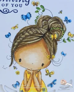 Close up Coloured digiatl stamp Dreaming of Summer All Dressed Up Stamps Close-up of the coloured digital stamp 'Dreaming of Summer,' used in a Thinking of You card. The image features a girl in a yellow dress, coloured with alcohol markers. The colors used include shades of tanned skin, peachy blush, and sky blue for added detail.