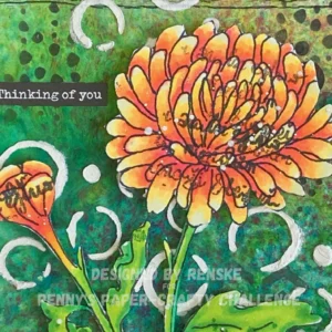 Close up picture coloured chrysanthemum fall flower Close-up of the chrysanthemum flower on the handmade mixed media card. The flower is shaded in bright yellows, oranges, and reds, with intricate details and vibrant coloring using alcohol markers. Highlights of metallic white paint splatters are visible on the petals.