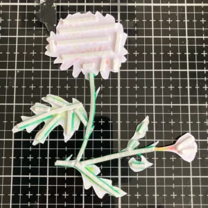 Foam tape on the back of th chrystanthemum digital stamp Back view of the cut-out flower from the handmade card, showing foam strips attached to provide dimension when placed on the card background. The foam strips are neatly positioned along the edges and stems of the flower.