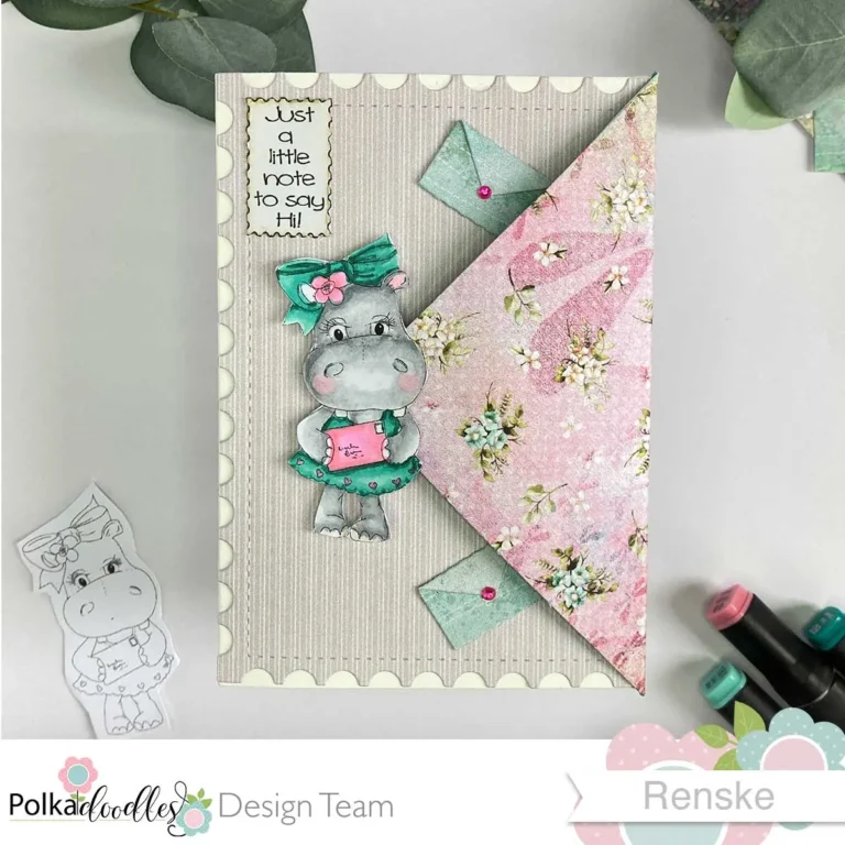 Top down view of a closed envelope flap card featuring a Polkadoodles' Helga Hippo digital stamp. he front of the card shows a pastel-coloured background with beige patterned paper, a hippo wearing a teal grean dress and bow, and holding a pink letter. Decorative elements include a sentiment post stamp saying just a little note to say Hi, and decorate mint green envelopes with pink pearls.