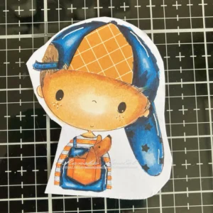 Coloured digital stamp Dude from All dressed up stamps Cut-out and coloured digital stamp 'Little Dude' with paper pieced cap. The stamp is fully coloured and ready to be attached to the DIY money roll box. The boy's clothing is in shades of blue and orange.