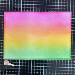 Ink blended background with Distress inks with pink, yellow and green Blended distress ink background for an autumn card. The card’s background shows a subtle blend of warm pink, yellow, and green tones, mimicking an autumn landscape. This distress ink technique adds depth and texture, perfect for handmade autumn cards.