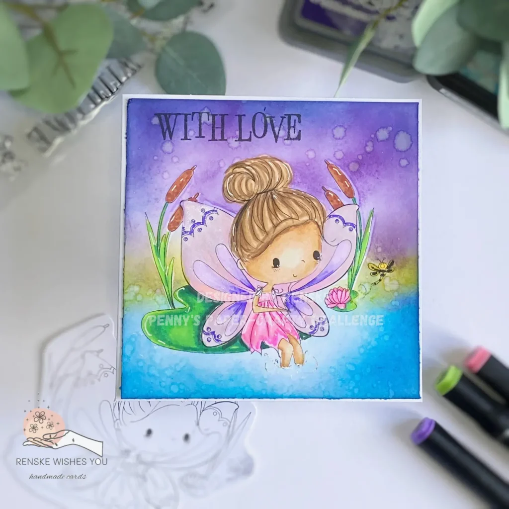 An overhead view of a magical one-layer card featuring a whimsical fairy sitting gracefully on a vibrant green lily pad. The background is a blue water pool and a purple sky with sparkles and colorful flowers surrounding the fairy, creating an enchanting scene.
