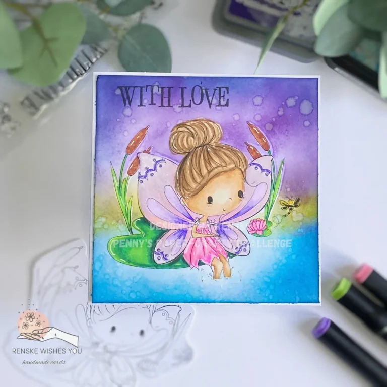 An overhead view of a magical one-layer card featuring a whimsical fairy sitting gracefully on a vibrant green lily pad. The background is a blue water pool and a purple sky with sparkles and colorful flowers surrounding the fairy, creating an enchanting scene.