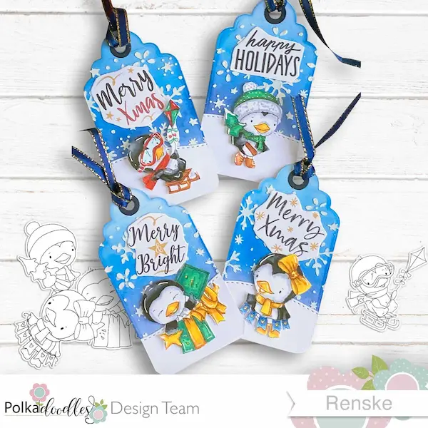 Four festive penguin christmas tags featuring digital stamps from the Waddy and Wanda collection, surrounded by printed stamp images. Each tag showcases vibrant holiday colours and adorable penguin designs