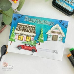 Christmas village slider card Yvonnen Creatiions 3 Angled top view of a flat Christmas slider card with the car at the end of the slider, highlighting the festive village and intricate details.