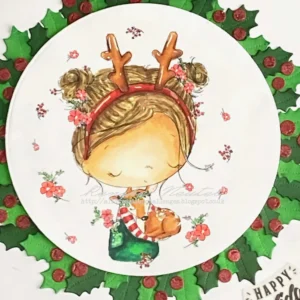 Close up from the coloured digital stamp Christmas hugs with holly wreath (2) Close-up of the Christmas Hugs digital stamp from All Dressed Up Stamps, featuring a girl hugging a deer. The girl is surrounded by a lush wreath of holly leaves and red berries. The soft details of the coloring, including the girl's dress and the deer's fur, are visible along with the festive greenery framing the image.