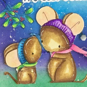 A close-up of the coloured digital stamp Mice Mistletoe from All Dressed Up Stamps The two mice are coloured in shades of brown, with the larger mouse wearing a pink scarf and purple headband, while the smaller mouse has a green scarf and blue headband. The mice stand beneath a sprig of mistletoe, and highlights are added with a white gel pen to give them depth and dimension against the winter night background